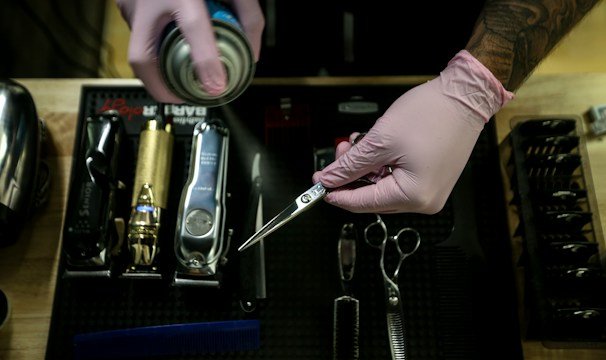 person holding stainless steel tool
