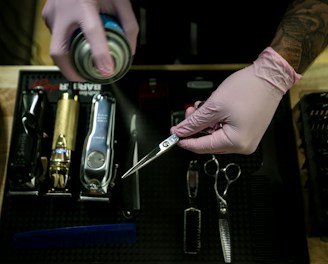 person holding stainless steel tool