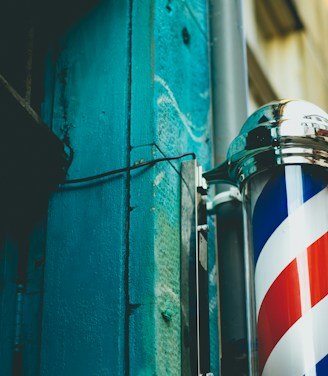 close-up photography of gray stainless steel dispenser